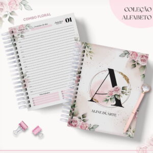 Cadernos espirais com estampa floral, caneta rosa e prendedores de papel sobre fundo branco.