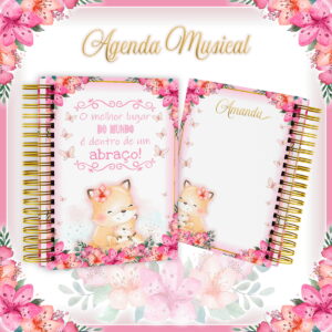 Agenda com espiral dourada, estampa de raposas e flores cor-de-rosa em fundo branco