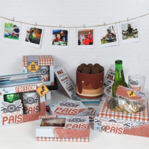 Cesta de presente decorada com tema de Dia dos Pais com fotos penduradas.