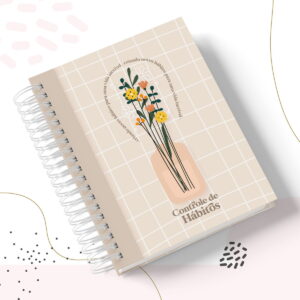 Caderno espiralado com capa bege quadriculada, ilustração de flores e texto.
