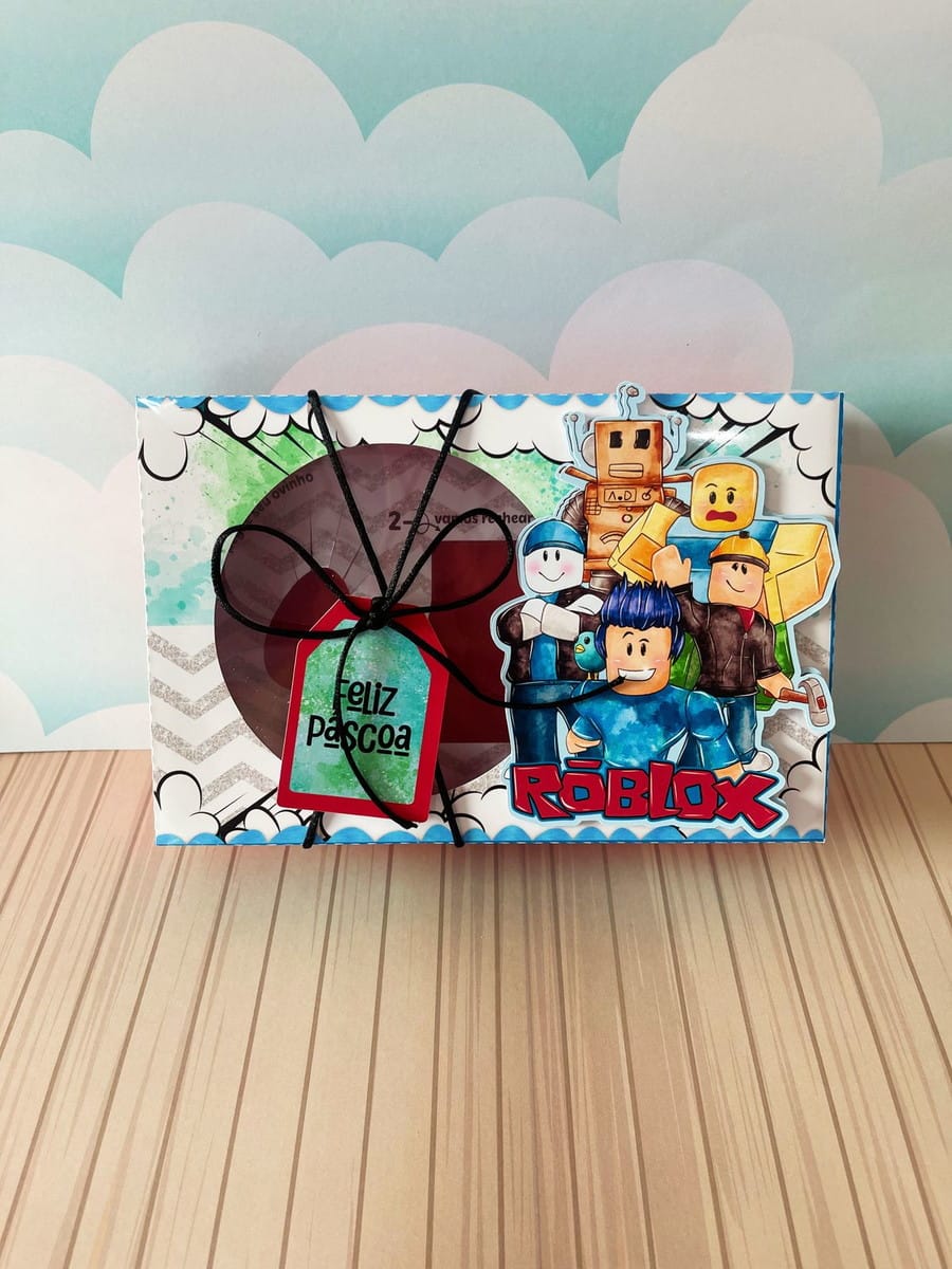 Caixa Mini Confeiteiro Roblox Menino em Arquivo Digital 3 Design de caixa de Páscoa com personagens de blocos, logo 'ROBLOX' e tag 'Feliz Páscoa'.