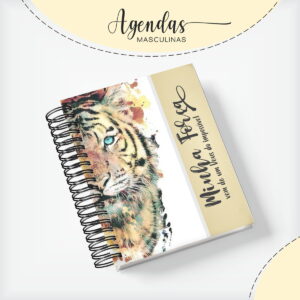 Agenda com capa ilustrada contendo o rosto de um tigre com olhos azuis