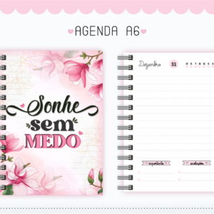 Agenda A6 com capa floral rosa e página interna pautada de dezembro.