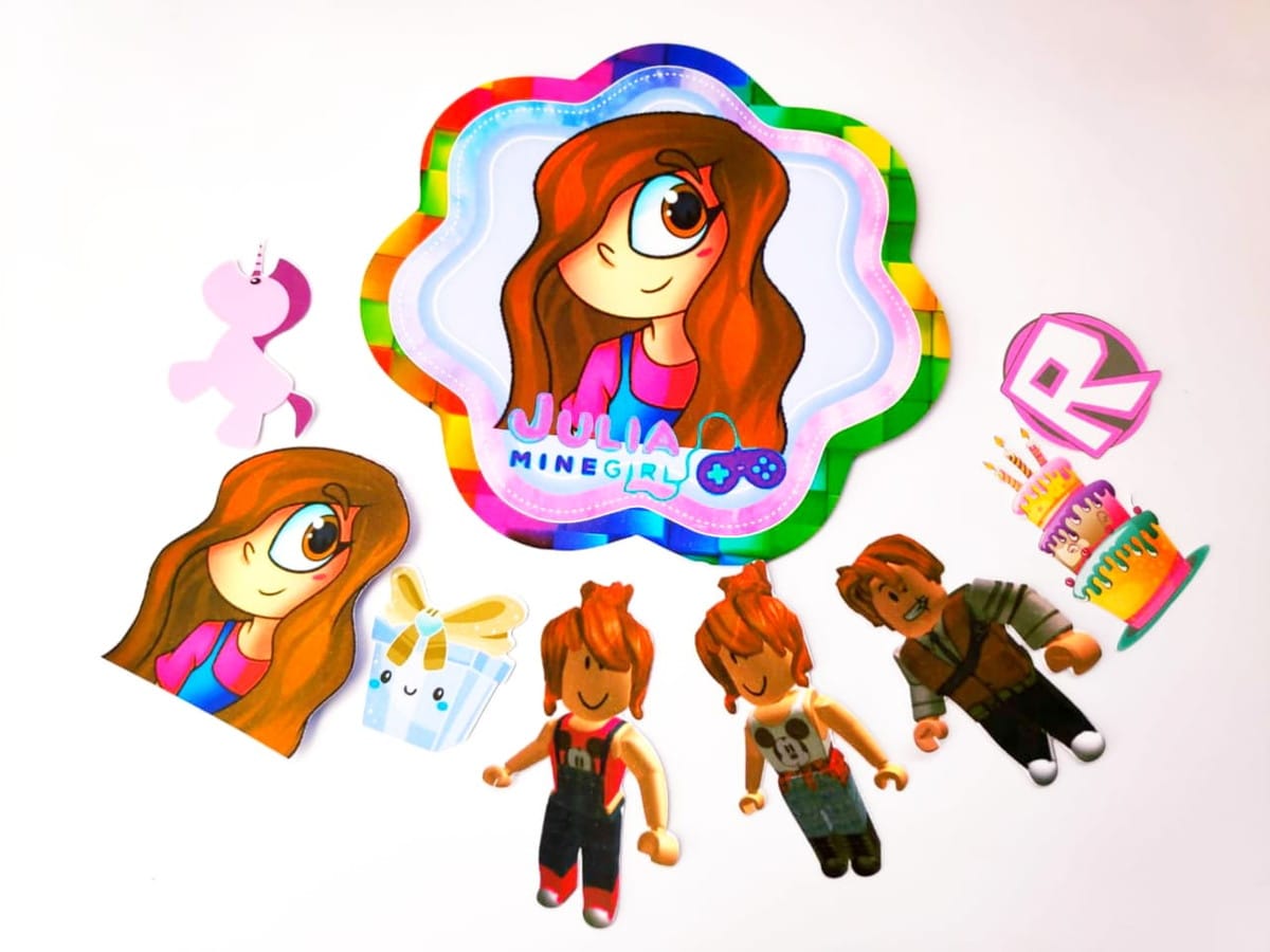 Kit Festa Só um Bolinho Julia Minigirl em PDF e Studio 1 Recortes digitais coloridos de personagens e símbolos de jogos em fundo branco.