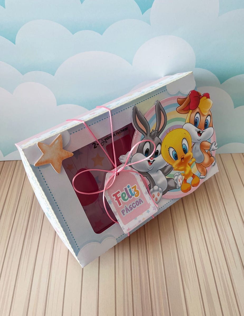 Caixa Mini Confeiteiro Looney Tunes em PDF e Studio 5 Design de caixa de Páscoa com personagens, ovos vermelhos e tag "Feliz Páscoa".
