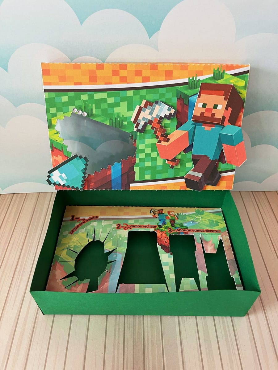 Kit Digital Mini Confeiteiro Minecraft para Doces 2 Caixa de papel temática com arte digital de personagem pixelado e instruções.